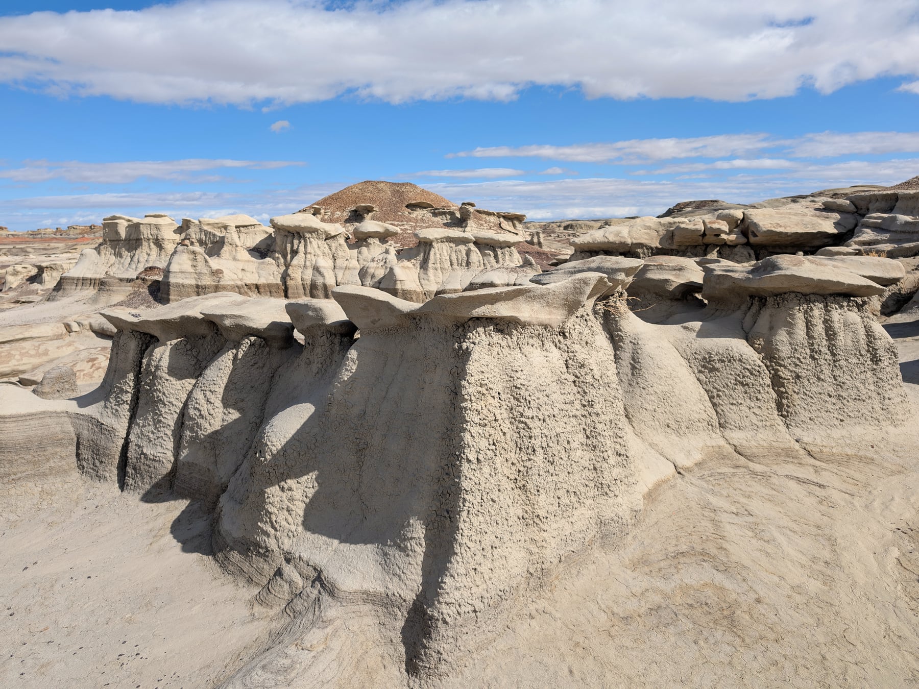 Dramatic hoodoo rock formations and eroded badlands at Bisti De-Na-Zin Wilderness at sunset in northwestern New Mexico